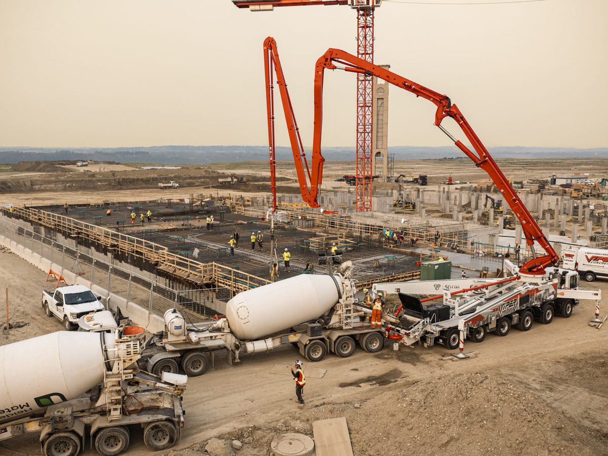 Aerial view of a tower crane and formwork during a foundation pour